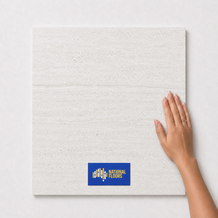 Ivory Travertine TK4 600x600 tile with hand scale and National Floors card