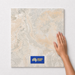 Lunar Hollow TK9 600x600 tile with hand scale and National Floors card