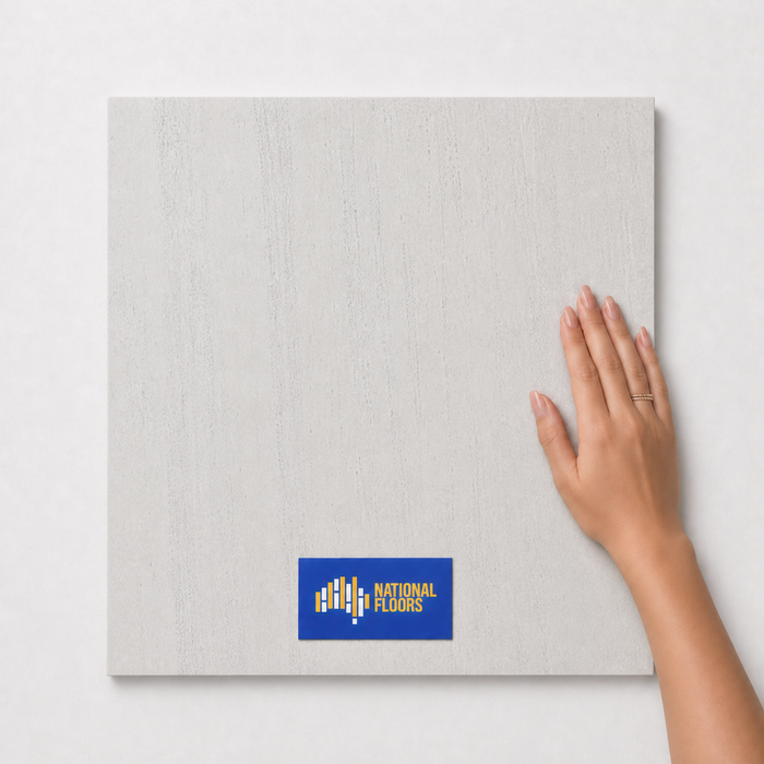 Oasis Pure TK1 600x600 tile with hand scale and National Floors card