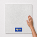 Ivory Wraith TFD5 600x600 tile with hand scale and National Floors card