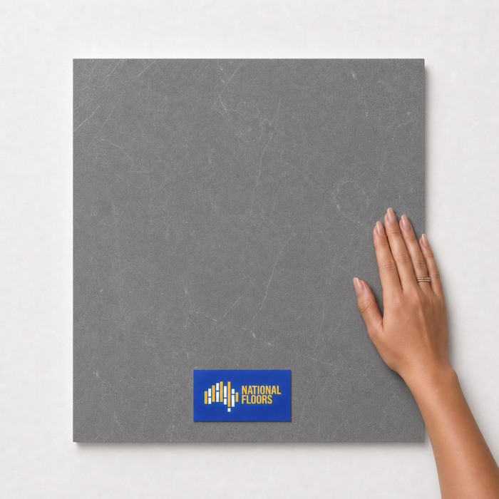 Gunmetal TM12 600x600 tile with hand scale and National Floors card
