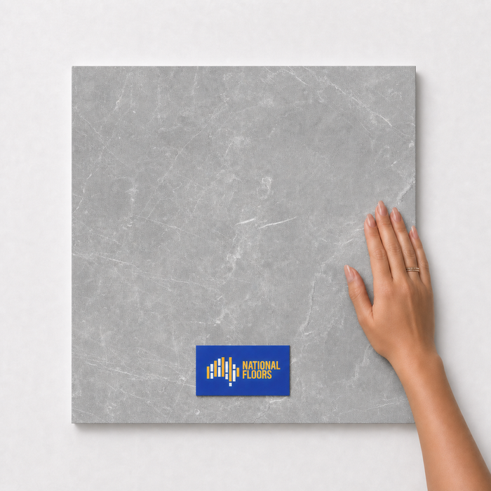 Silver Grey TM15 600x600 tile with hand scale and National Floors card