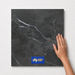 Midnight Grey TM16 600x600 tile with hand scale and National Floors card