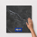 Smoky Black TM17 600x600 tile with hand scale and National Floors card
