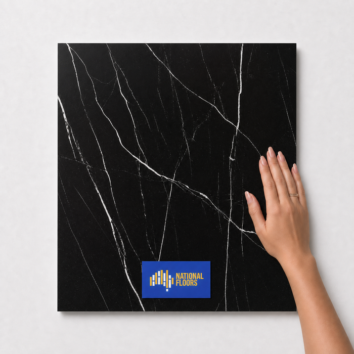 Jet Black TM28 600x600 tile with hand scale and National Floors card
