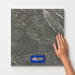 Steel Grey TM18 600x600 tile with hand scale and National Floors card