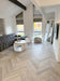 8mm hybrid herringbone installed by National Floors