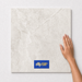 Zion Ivory TK32 600x600 tile with hand scale and National Floors card